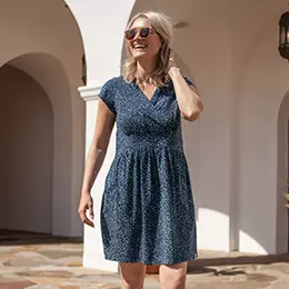 Woman standing outside wearing Old Ranch Brands dress.